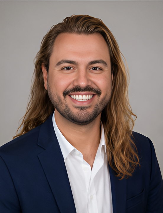 Professional portrait of Dr. Theofanis (Fanis) Aritzis with long hair